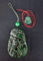 A CHINESE GREEN 'JADE' PENDANT