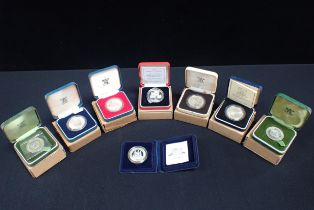 A COLLECTION OF SILVER PROOF CROWNS