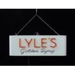 A VINTAGE ILLUMINATED ADVERTISING SIGN; 'LYLE'S GOLDEN SYRUP'