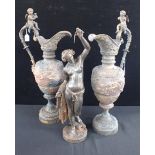 A PAIR OF CAST METAL RENAISSANCE STYLE EWERS WITH CHERUB HANDLES