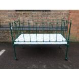 A VICTORIAN IRON COT, WITH BRASS KNOBS
