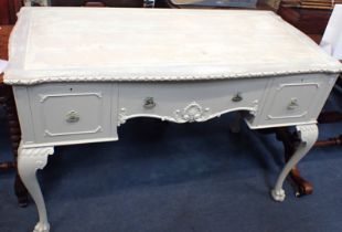 A PAINTED MAHOGANY DESK, ON CABRIOLE LEGS