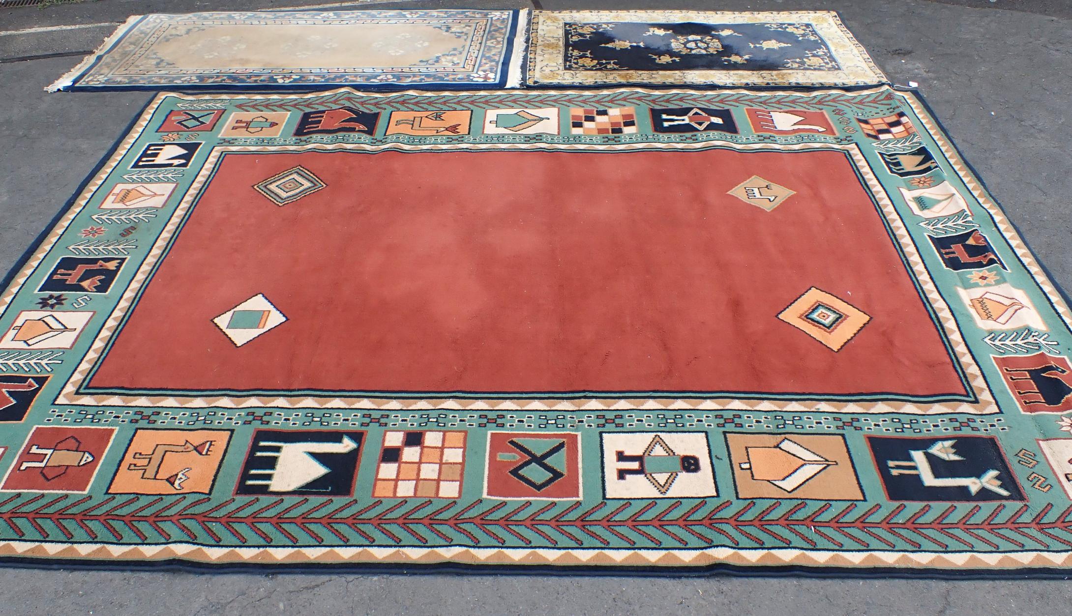 TWO CHINESE RUGS, AND A LARGER RUG