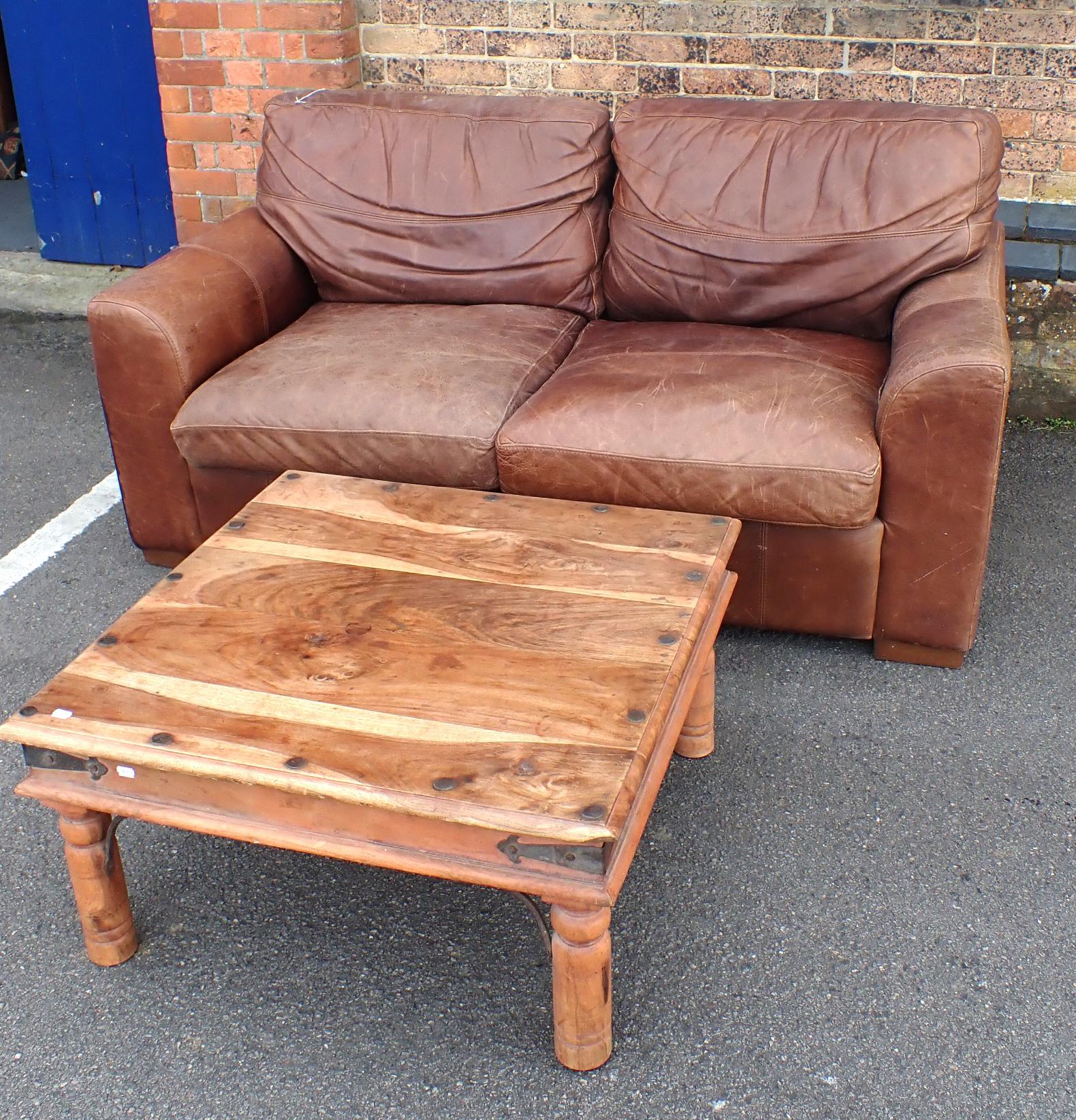 A MODERN LEATHER TWO-SEAT SOFA