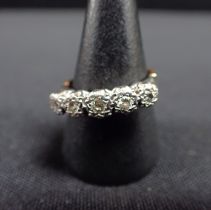 A FIVE STONE DIAMOND AND GOLD RING