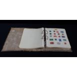 AN LEVER ARCH FOLDER OF MIXED INTERNATIONAL STAMPS