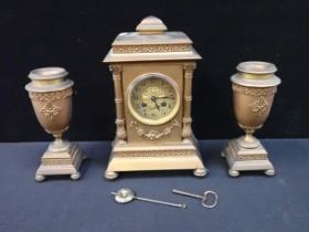 VINCENT & Cie; A BRASS CLOCK GARNITURE, WITH URNS