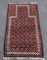 AN ANTIQUE BELOUCH PRAYER RUG