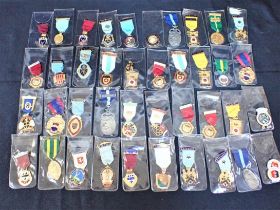 A COLLECTION OF MASONIC BADGES, ON RIBBONS