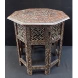 A 19th CENTURY INDIAN CARVED FOLDING TABLE