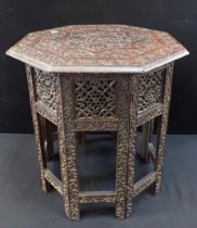 A 19th CENTURY INDIAN CARVED FOLDING TABLE
