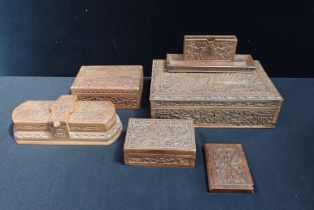 A GROUP OF CARVED HARDWOOD BOXES