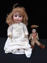 A BISQUE HEADED DOLL: 'HEUBACH. KOPPELSDORF. 300. 7'