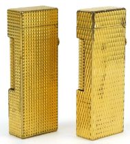 Two Dunhill gold plated pocket lighters with engine turned bodies : For further information on