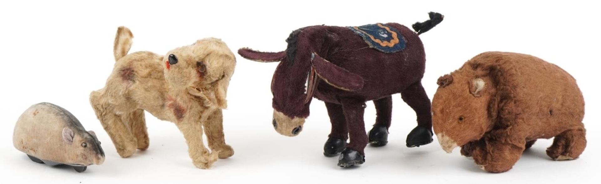 Four early 20th century clockwork animals including a Schuco mouse, bear with Made in Japan label