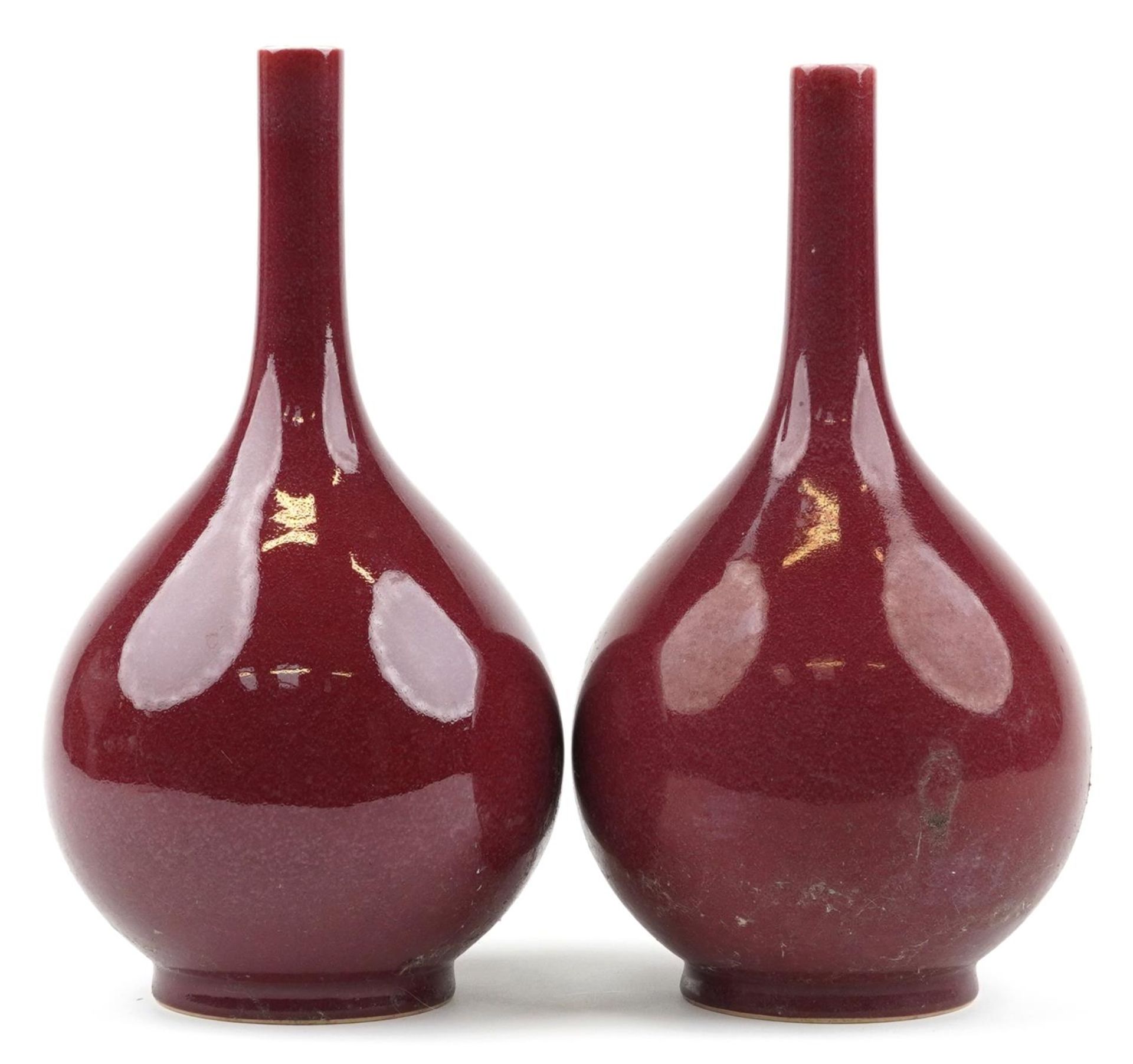 Pair of Chinese porcelain long neck bottle vases having sang de boeuf glazes, each 34cm high : For - Image 3 of 6