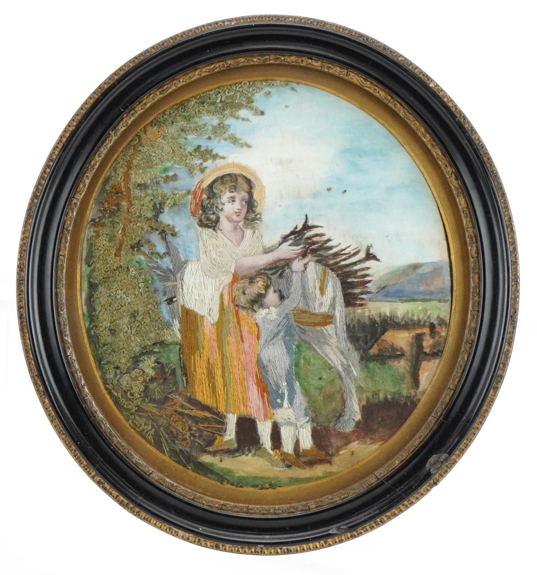 Mother and child with donkey collecting kindling, 19th century oval watercolour and silk work