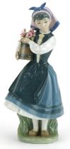 Lladro figurine of a female holding a bucket of flowers, Budding Blossoms, numbered 1416, 26cm