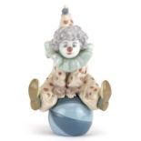 Lladro clown figure Having a Ball, numbered 5813, 18cm high : For further information on this lot