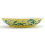 Chinese porcelain yellow ground dish hand painted in green with dragons chasing the flaming pearl