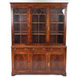 Georgian style mahogany library bookcase with lion mask handles, fitted with an arrangement of