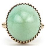Unmarked gold green hardstone ring, tests as 9ct gold, size R, 8.6g : For further information on