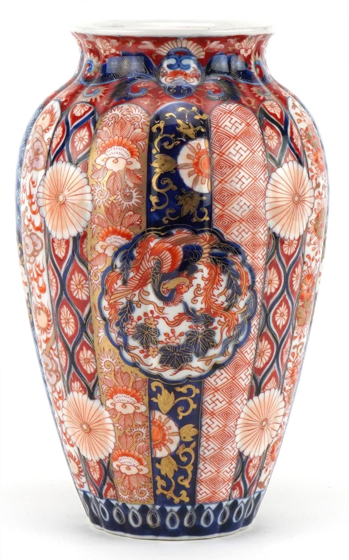 Japanese Imari porcelain fluted vase hand painted with flowers and stylised roundels enclosing