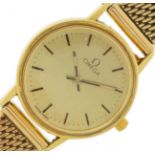 Omega, ladies 18ct gold wristwatch with 9ct gold strap with paperwork and Garrard & Co box, 21mm