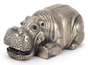 Silver recumbent hippopotamus with cabochon ruby eyes, impressed Russian marks to the base, 7.5cm in