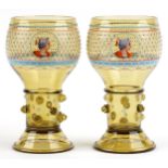 Attributed to Moser, Matched pair of 19th century Bohemian over sized goblets each enamelled with