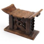 African tribal interest hardwood seat in the form of a headrest, 31cm H x 43.5cm W x 19cm D : For
