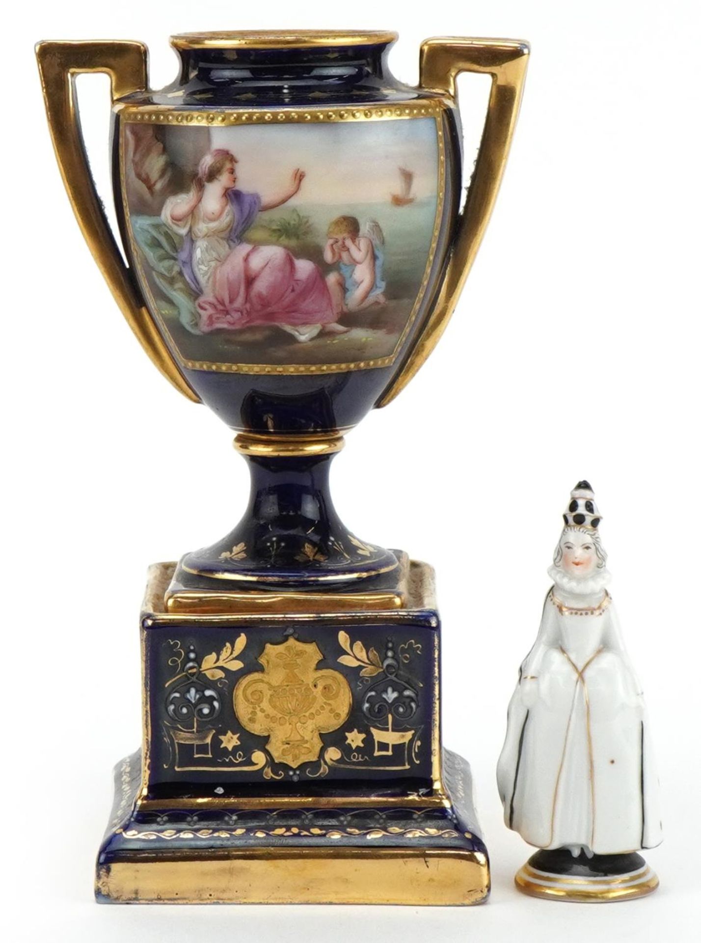 Vienna, Austrian miniature porcelain figure of a female Pierrot and an urn vase hand painted with