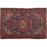 Rectangular Persian blue and red ground rug having and allover floral design, 146cm x 103cm : For