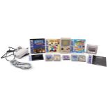 Vintage Nintendo Game Boy Advance with accessories and three games comprising Mickey Mouse, Super
