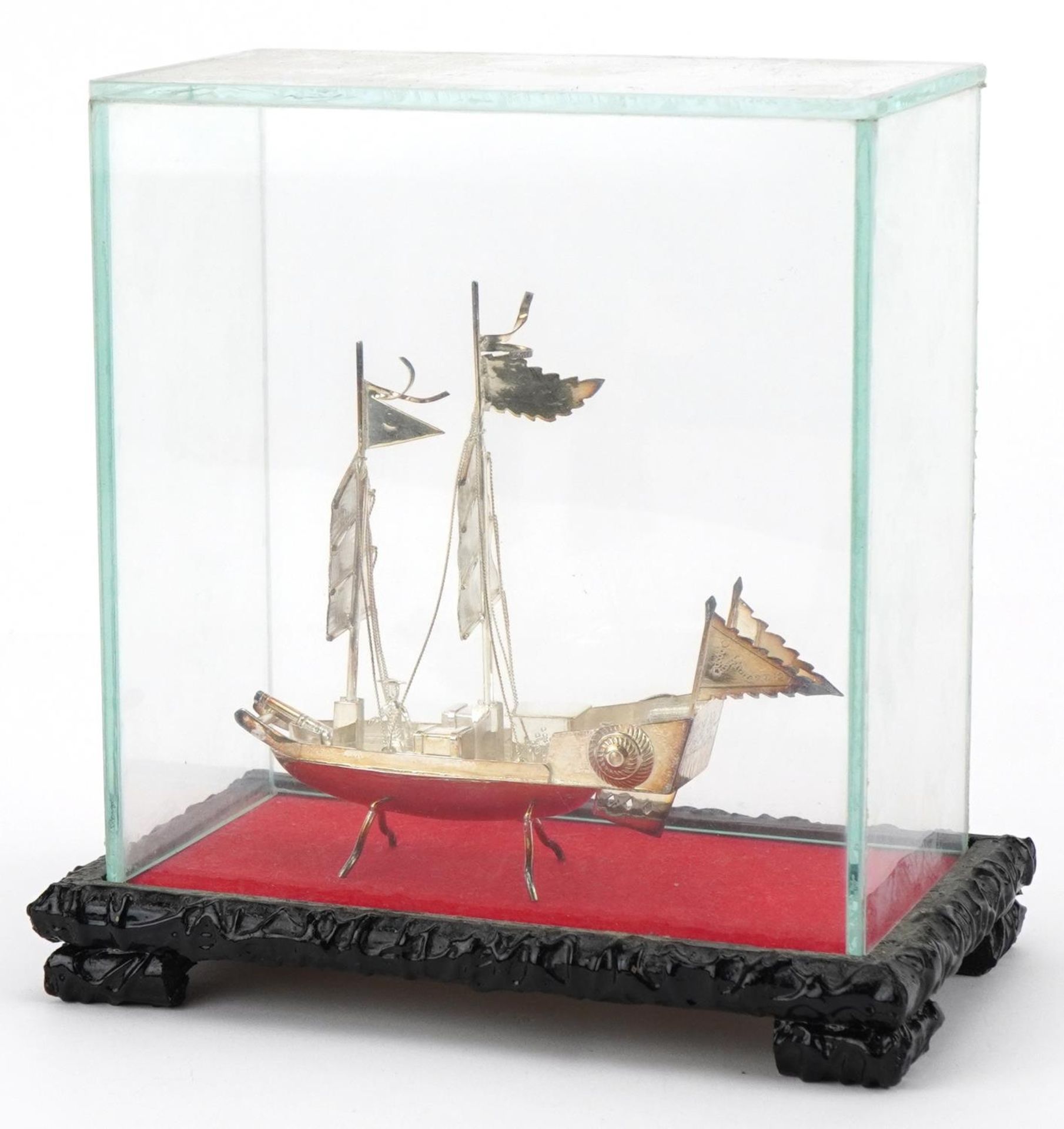 Chinese sterling silver model of a junk housed in a glass display case, overall 16cm high, weighable