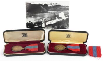 Two military interest Elizabeth Superior Service medals with cases awarded to Cyril Bucksey and