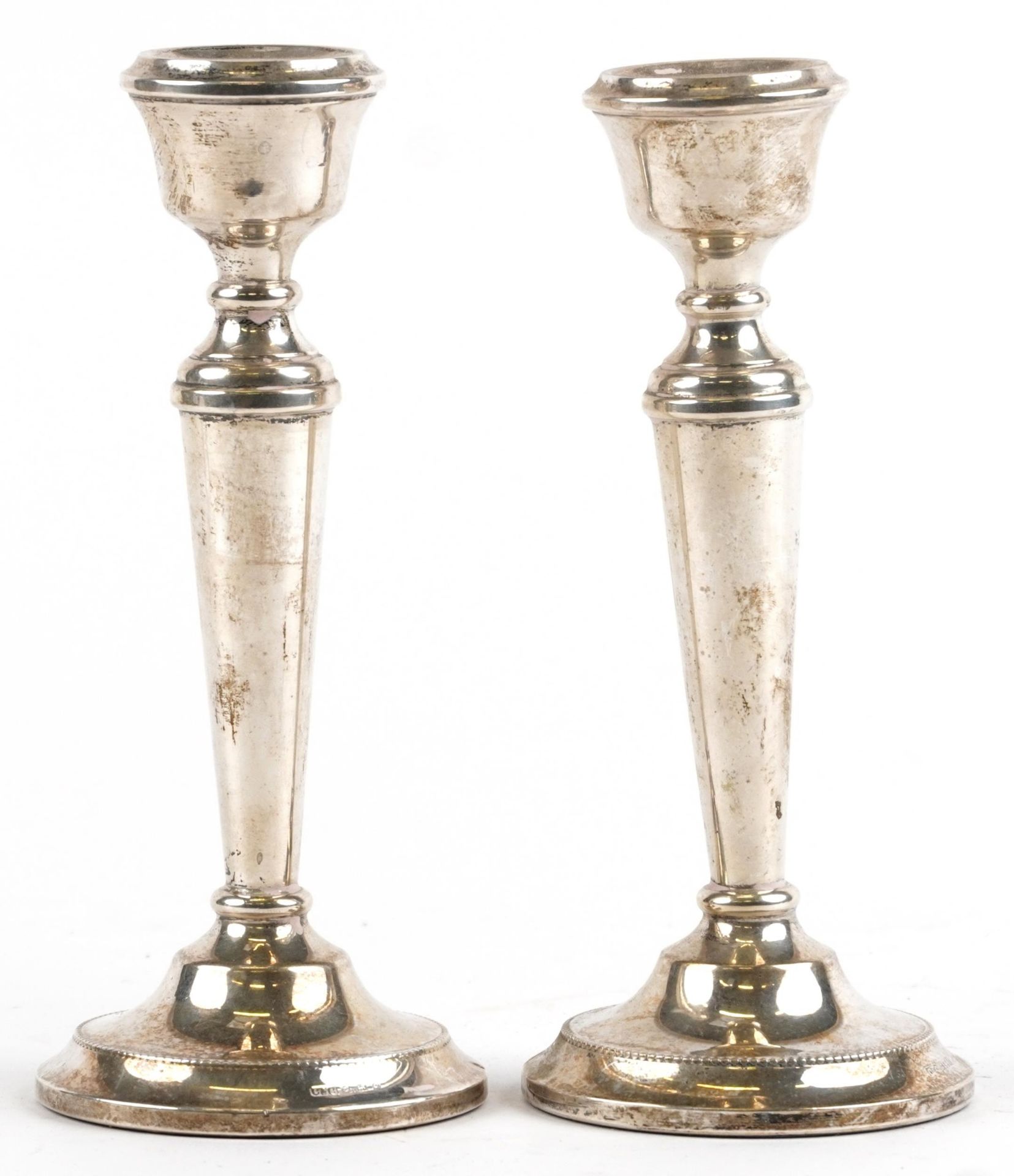 Cohen & Charles, pair of Elizabeth II silver tapering candlesticks, Birmingham 1963, 18.5cm high,