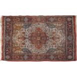 Rectangular Persian rug with red ground border having and allover repeat floral design, 190cm x