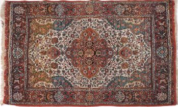 Rectangular Persian rug with red ground border having and allover repeat floral design, 190cm x