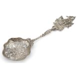 Dutch silver sifting spoon, the bowl embossed with a young farm girl with mermaid and rigged sailing