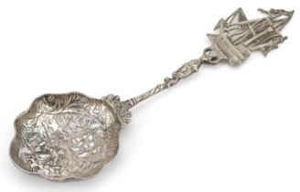 Dutch silver sifting spoon, the bowl embossed with a young farm girl with mermaid and rigged sailing