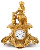 19th century French ormolu mantle clock surmounted with a mother and child striking on a bell with C