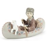 Lladro figure group of a boy with dog in a canoe, Little Explorer, numbered 6640, 25cm in length :