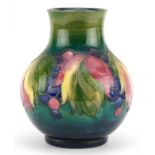 William Moorcroft pottery vase hand painted in the Leaf and Berry pattern, painted and impressed