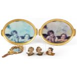 Antique and later gilt and Putti sundry items including acanthus design hand mirror and two trays,