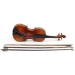 Old wooden violin with three bows and case, the violin back impressed Stainer, 14.25 inches in