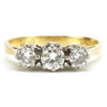 18ct gold diamond three stone ring, the central diamond approximately 0.25 carat, size K, 2.4g : For