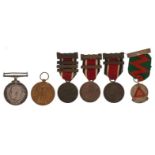British military World War I pair with related commemorative medals and a silver and enamel Five