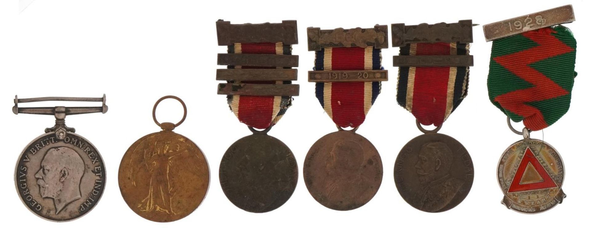 British military World War I pair with related commemorative medals and a silver and enamel Five