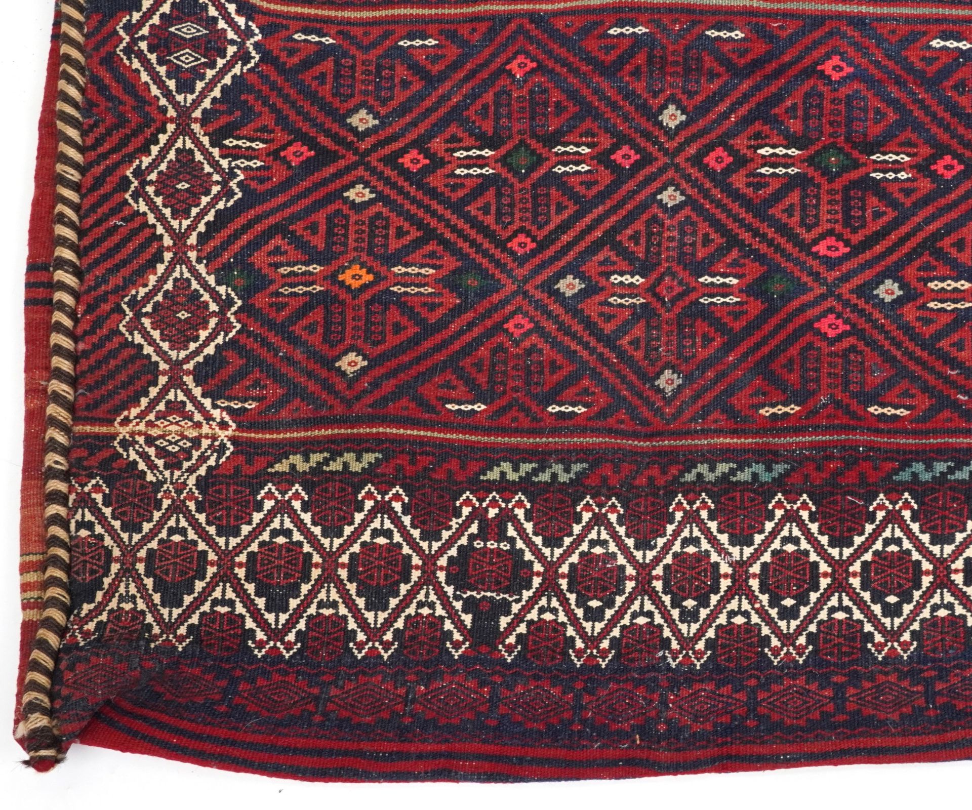 Rectangular Afghan red ground saddle bag having an allover repeat design, 150cm x 80cm : For further - Image 4 of 7